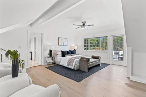 an aerial view of a house with a yard