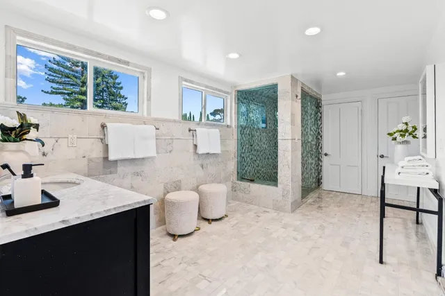 a backyard of a house with table and chairs