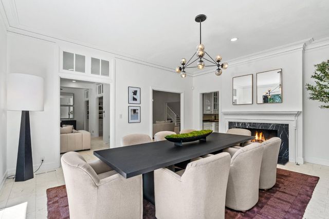 a kitchen with stainless steel appliances a sink stove and cabinets