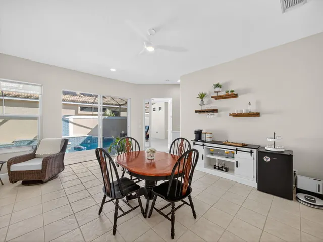 a dining room with furniture and window
