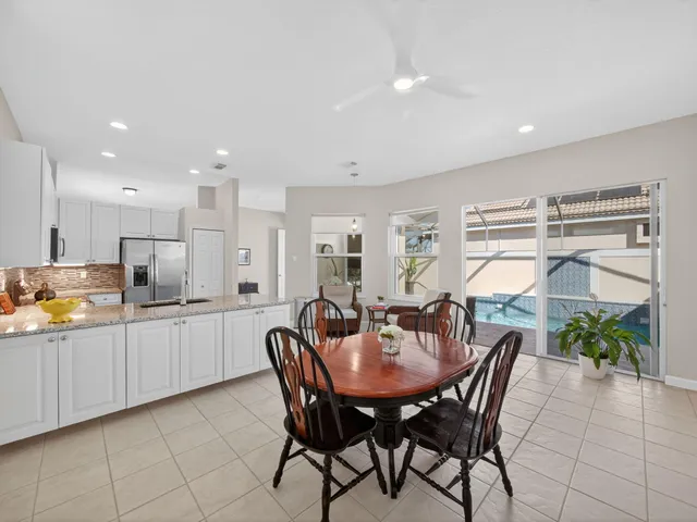 a kitchen with a table and chairs in it