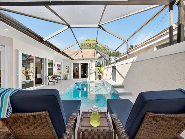 a view of a dining room with furniture wooden floor and a rug