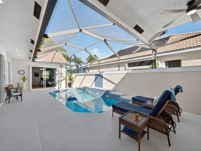 a view of a patio with a table and chairs