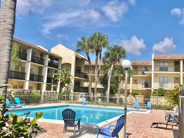 a view of a swimming pool with a patio