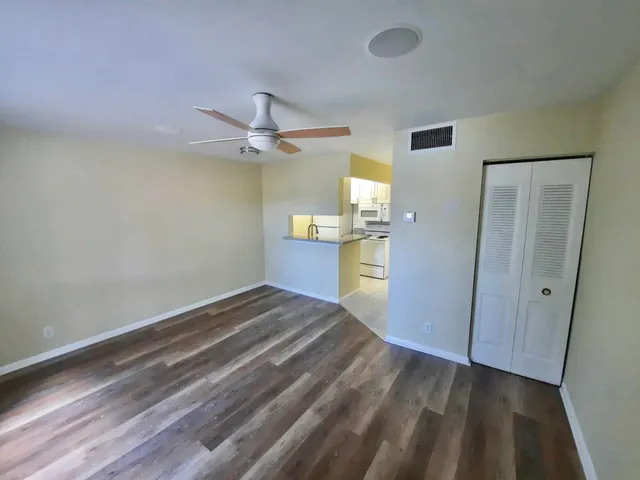 a view of a kitchen with a sink and cabinet area