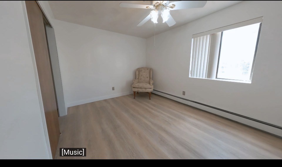 141 Pierce Street, Unit 12 Malden, MA 02148 - Photo 7 of 15 an empty room with windows