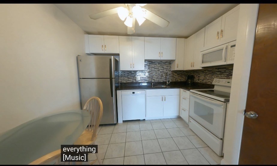 141 Pierce Street, Unit 12 Malden, MA 02148 - Photo 8 of 15 a kitchen with a sink a refrigerator and cabinets