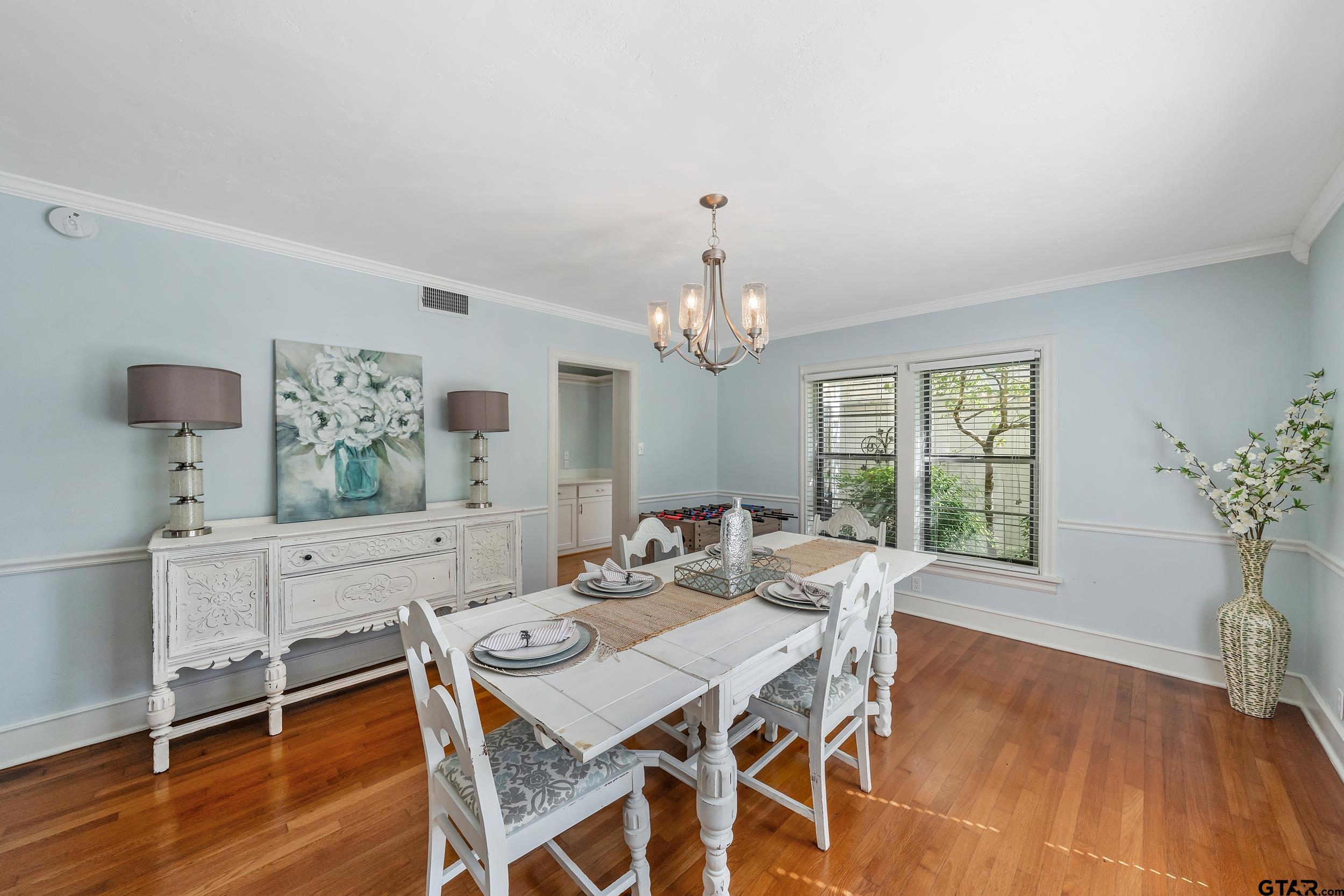 145 Rowland Place Tyler, TX 75701 - Photo 13 of 43 a view of a dining room with furniture window and wooden floor