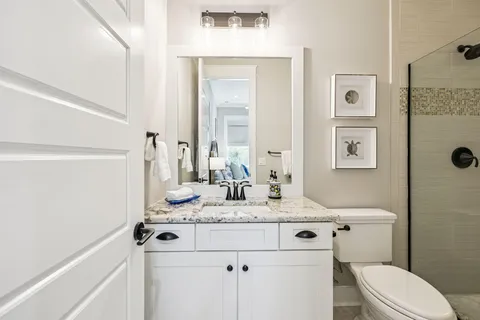 a bathroom with a tub and a shower