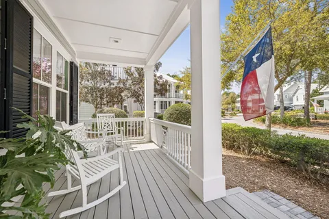 a view of a chair and tables in the patio