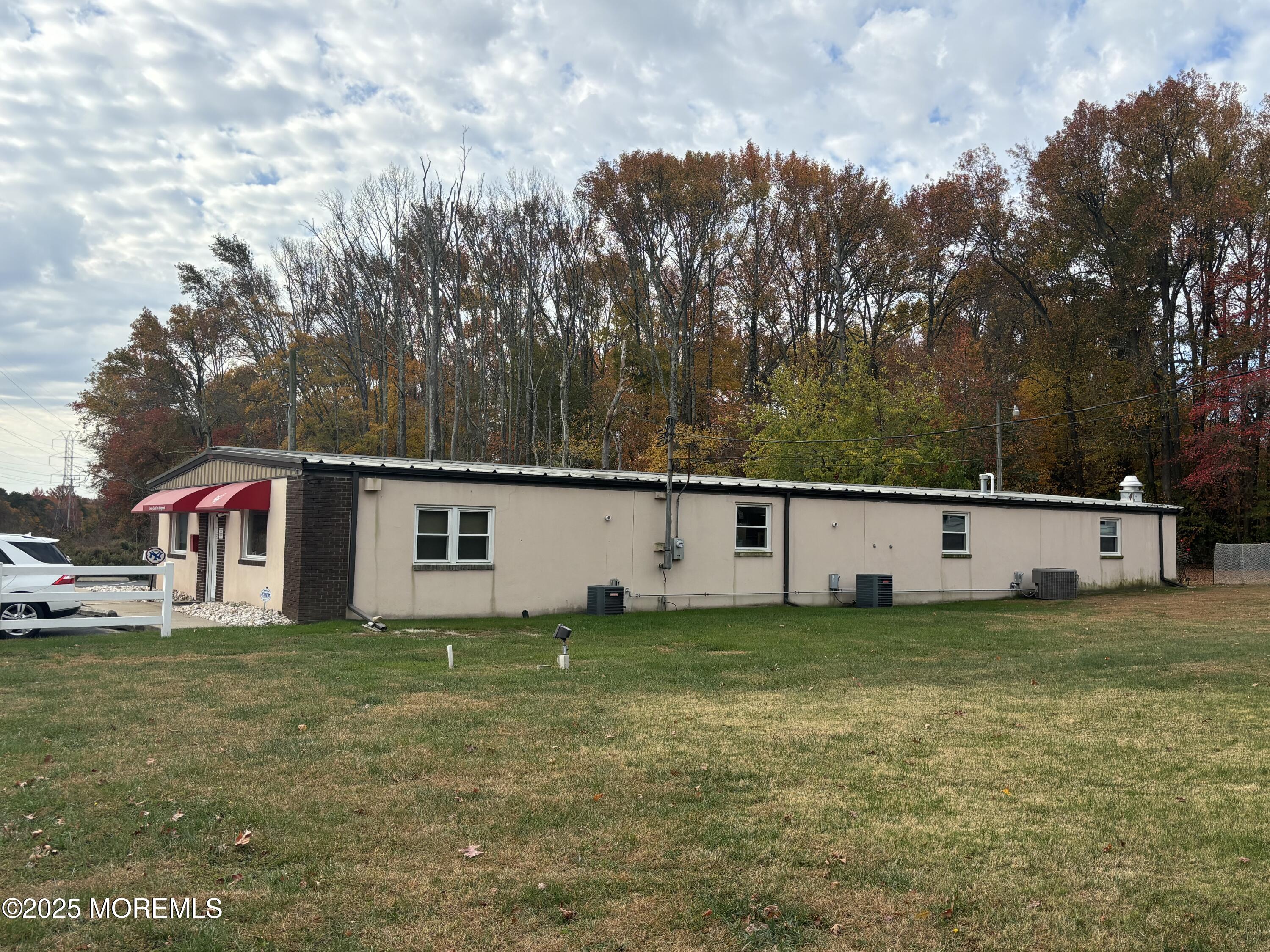 Asbury Road Farmingdale, NJ 07727 - Photo 4 of 9 a front view of a house with a yard
