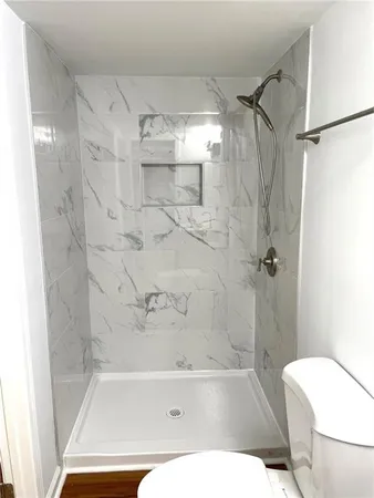 a bathroom with a bathtub and a shower