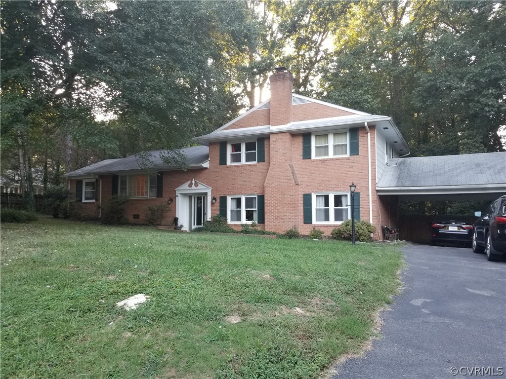 3520 Bittersweet Road Richmond, VA 23235 - Photo 1 of 15 a front view of a house with yard and green space
