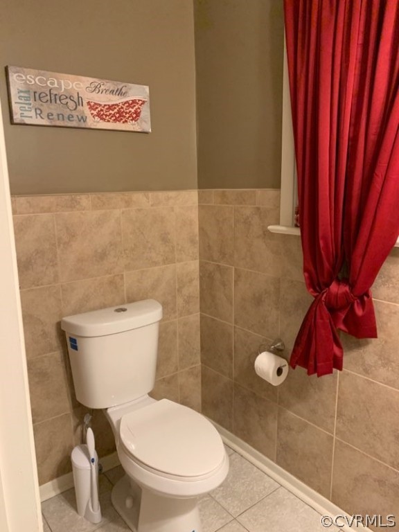3520 Bittersweet Road Richmond, VA 23235 - Photo 11 of 15 a white toilet sitting next to a bathroom sink