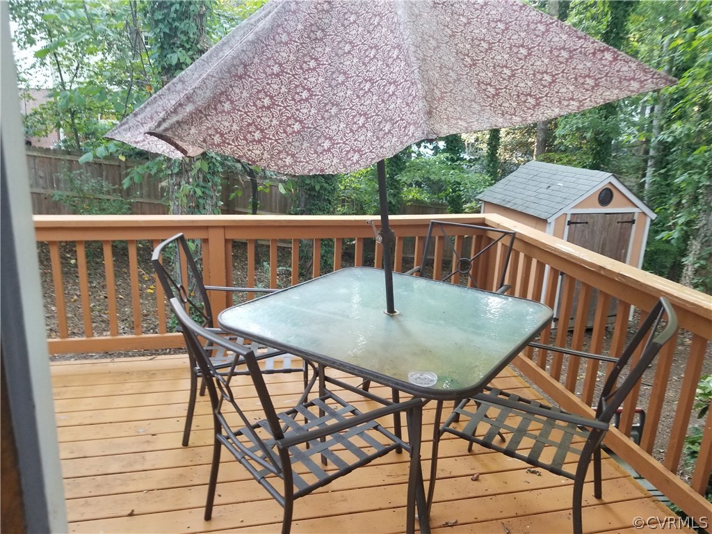 3520 Bittersweet Road Richmond, VA 23235 - Photo 3 of 15 a view of a balcony with table and chairs