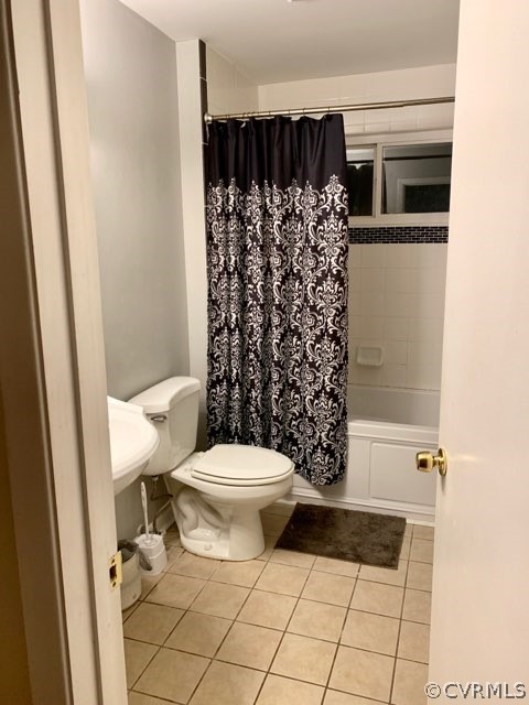 3520 Bittersweet Road Richmond, VA 23235 - Photo 4 of 15 a bathroom with a toilet and a shower curtain