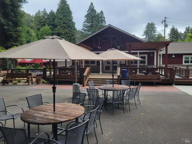 a patio with a table and chairs