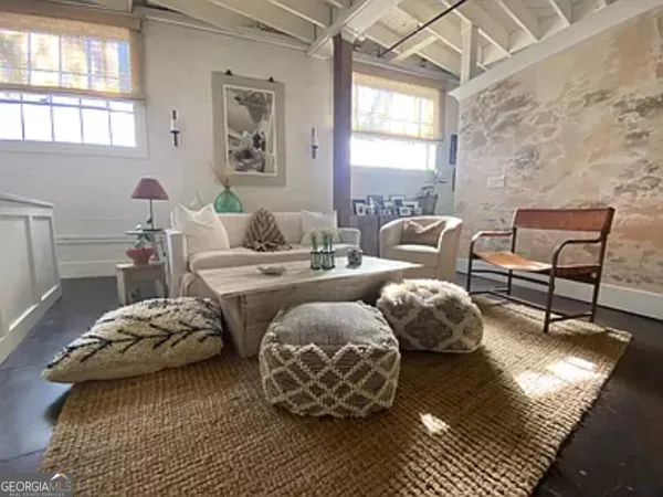 a bedroom with furniture and a window