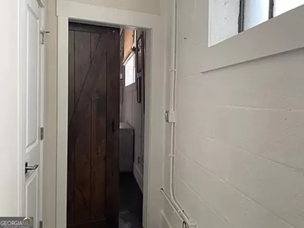a bathroom with a shower and a door