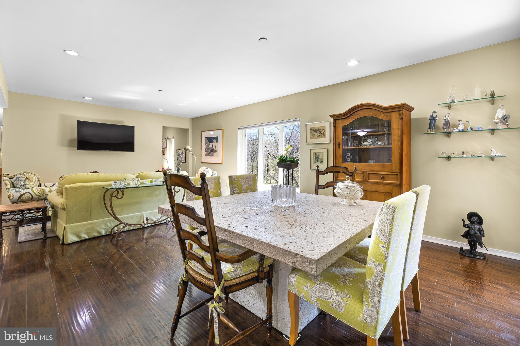 2331 Old Court Road, Unit 307 Baltimore, MD 21208 - Photo 11 of 54 a dining room with furniture and wooden floor