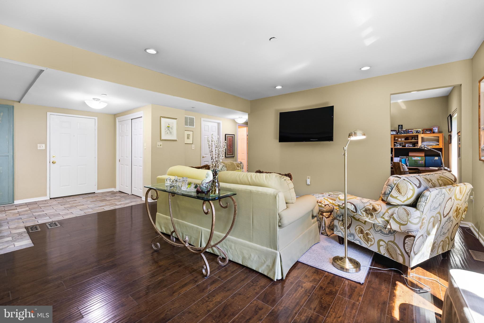 2331 Old Court Road, Unit 307 Baltimore, MD 21208 - Photo 12 of 54 a living room with furniture and a flat screen tv