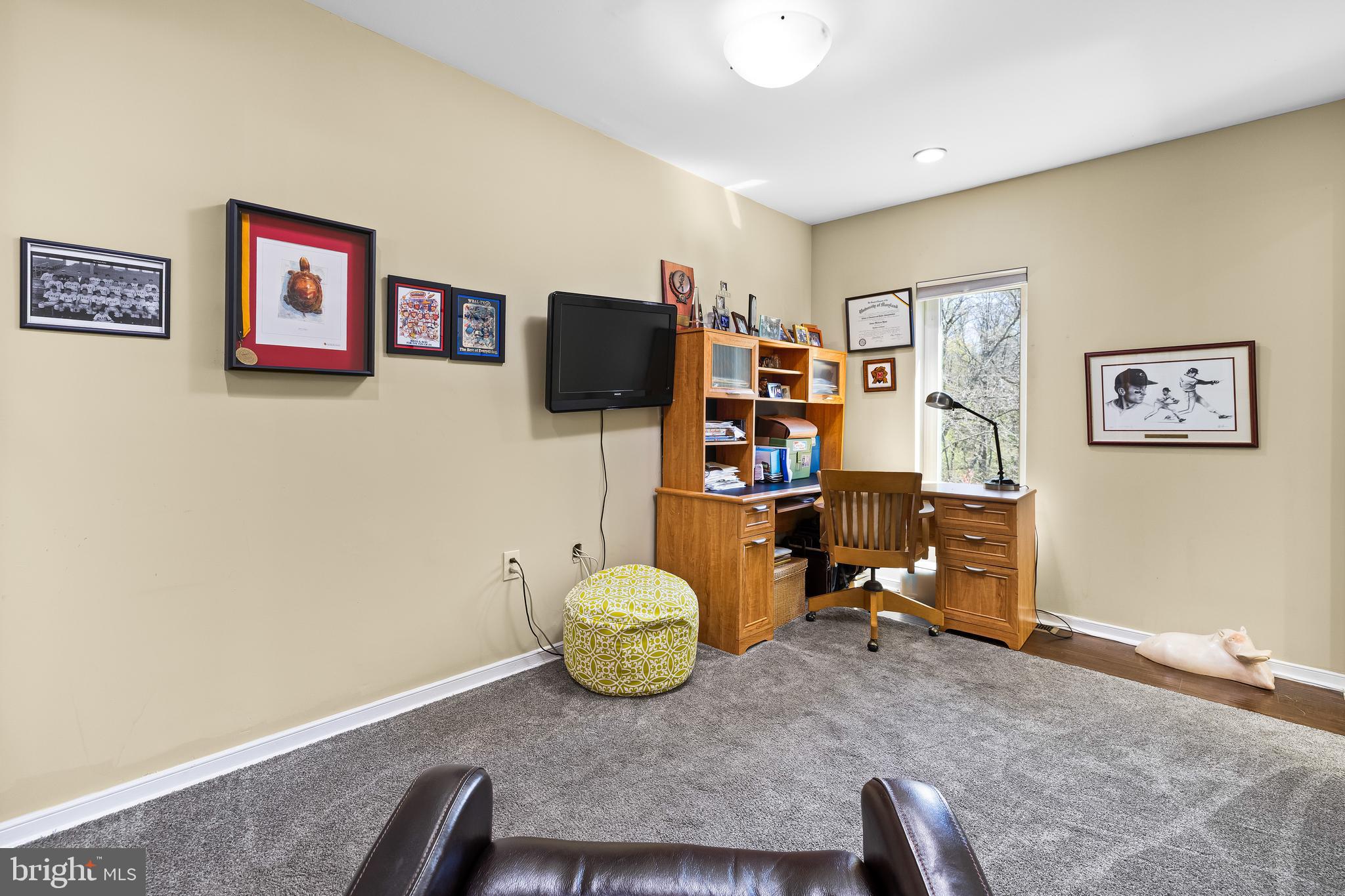 2331 Old Court Road, Unit 307 Baltimore, MD 21208 - Photo 20 of 54 a living room with furniture and a flat screen tv