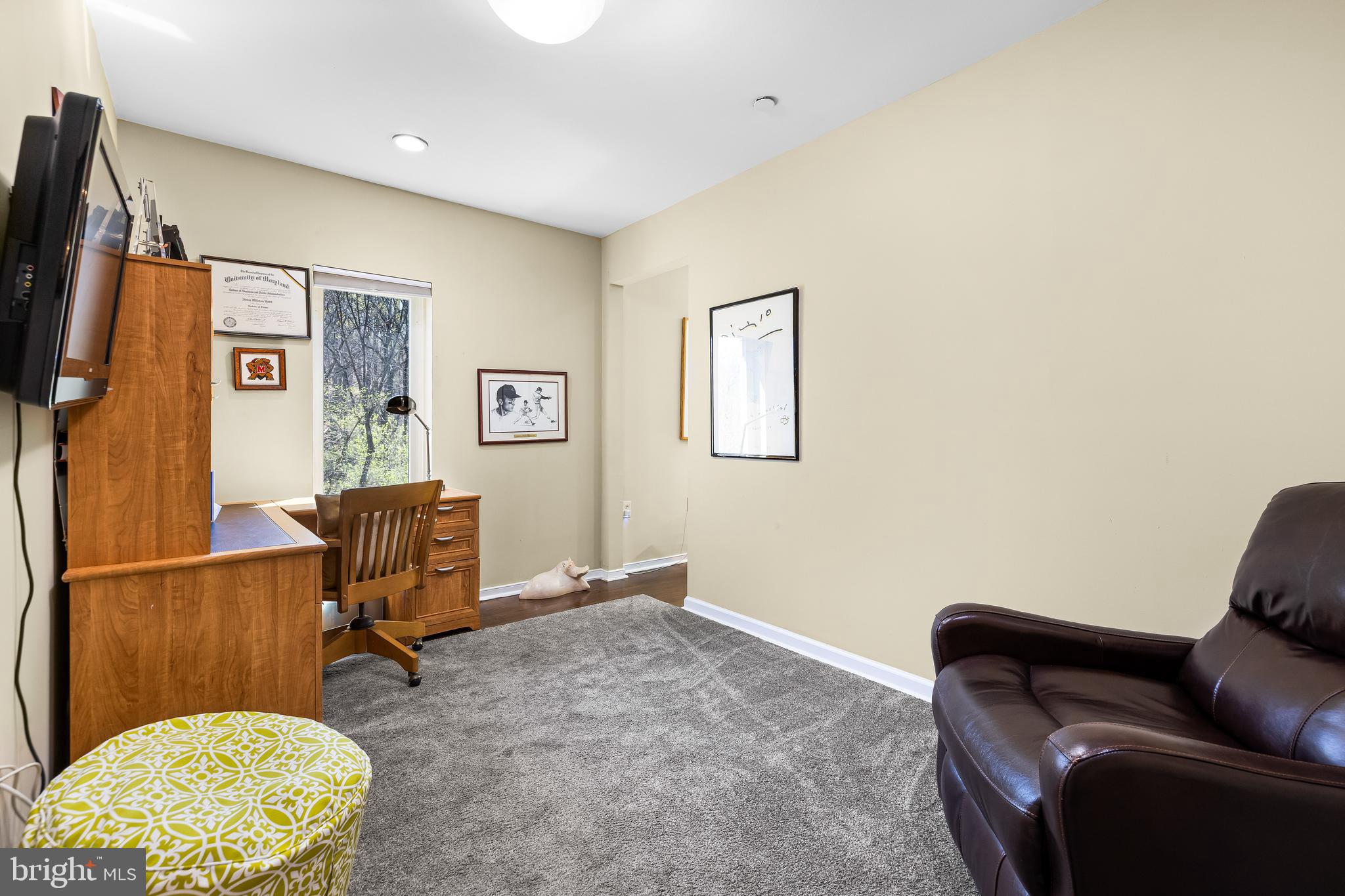 2331 Old Court Road, Unit 307 Baltimore, MD 21208 - Photo 21 of 54 a view of a livingroom with workspace and a couch