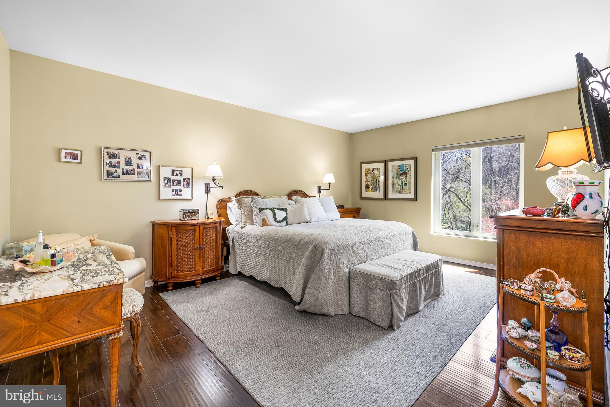 2331 Old Court Road, Unit 307 Baltimore, MD 21208 - Photo 22 of 54 a spacious bedroom with a bed and wooden floor