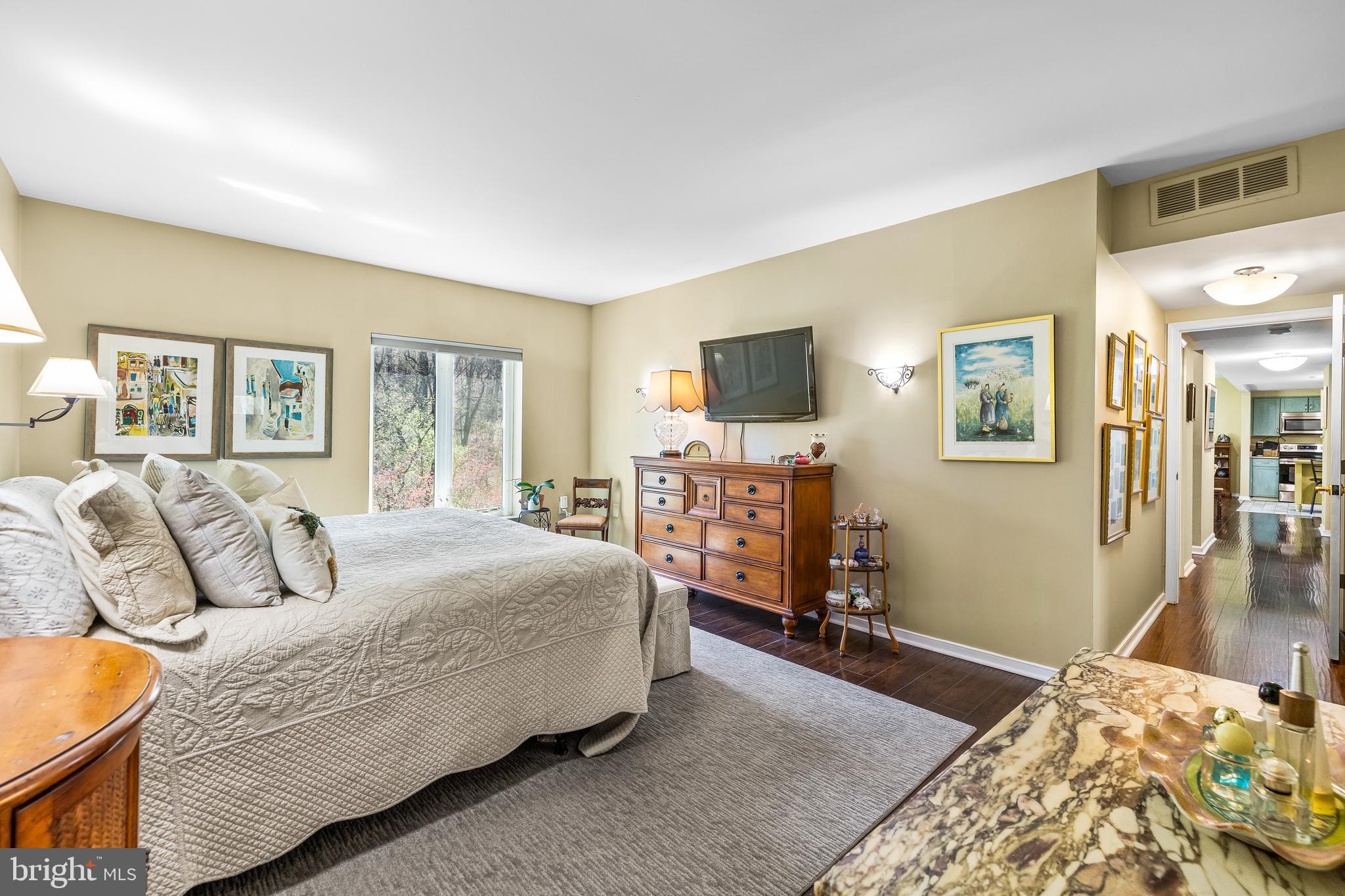2331 Old Court Road, Unit 307 Baltimore, MD 21208 - Photo 24 of 54 a bedroom with a bed and flat screen tv