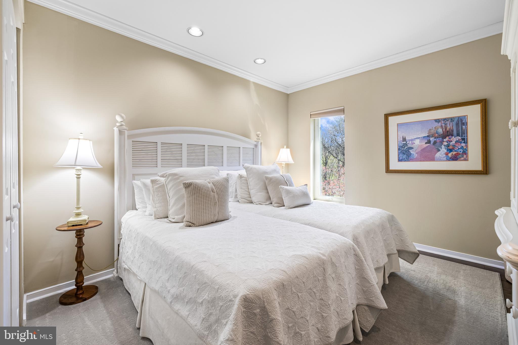 2331 Old Court Road, Unit 307 Baltimore, MD 21208 - Photo 28 of 54 a bedroom with a bed and a night stand