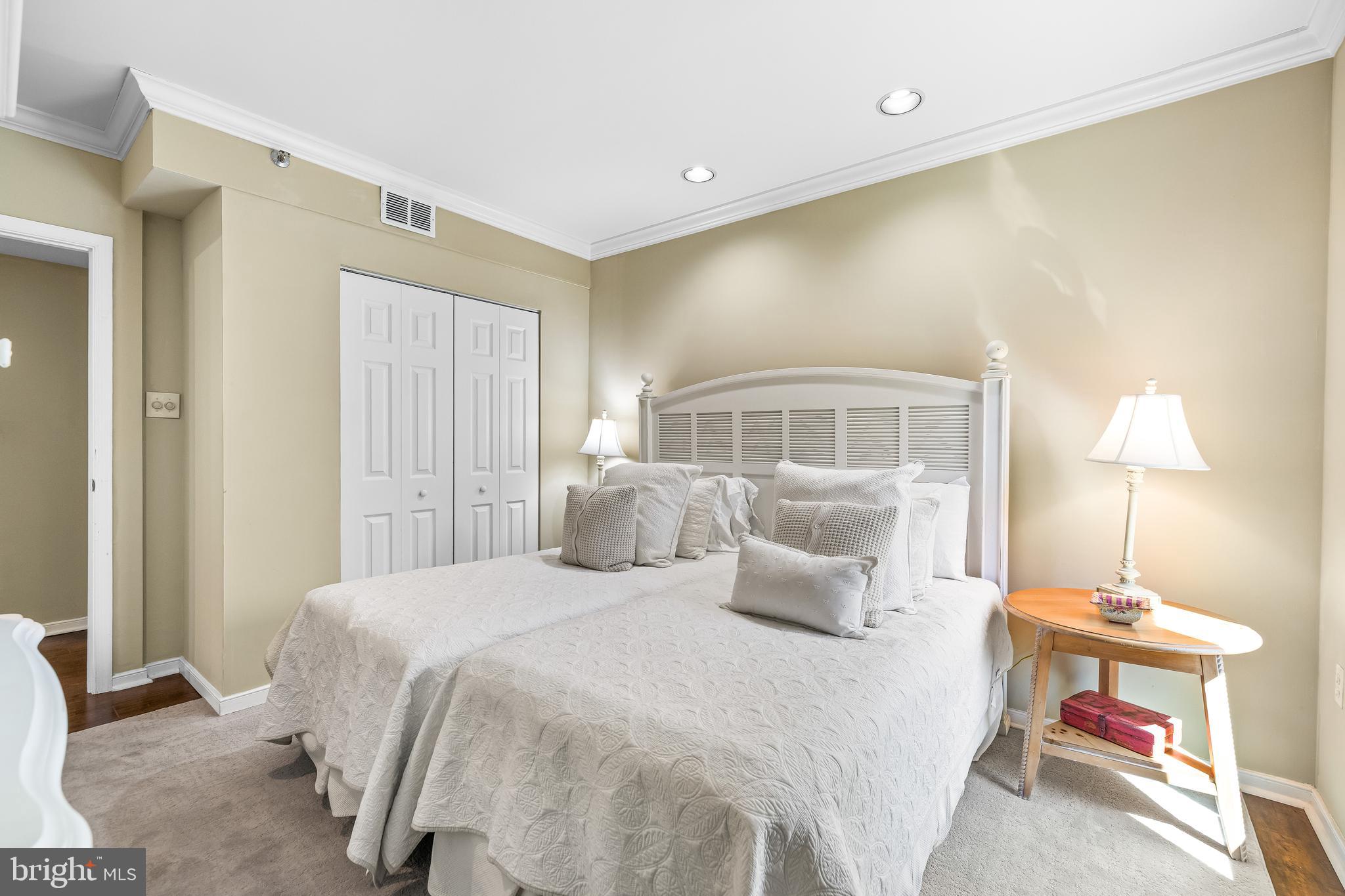 2331 Old Court Road, Unit 307 Baltimore, MD 21208 - Photo 29 of 54 a bedroom with a bed and lamp
