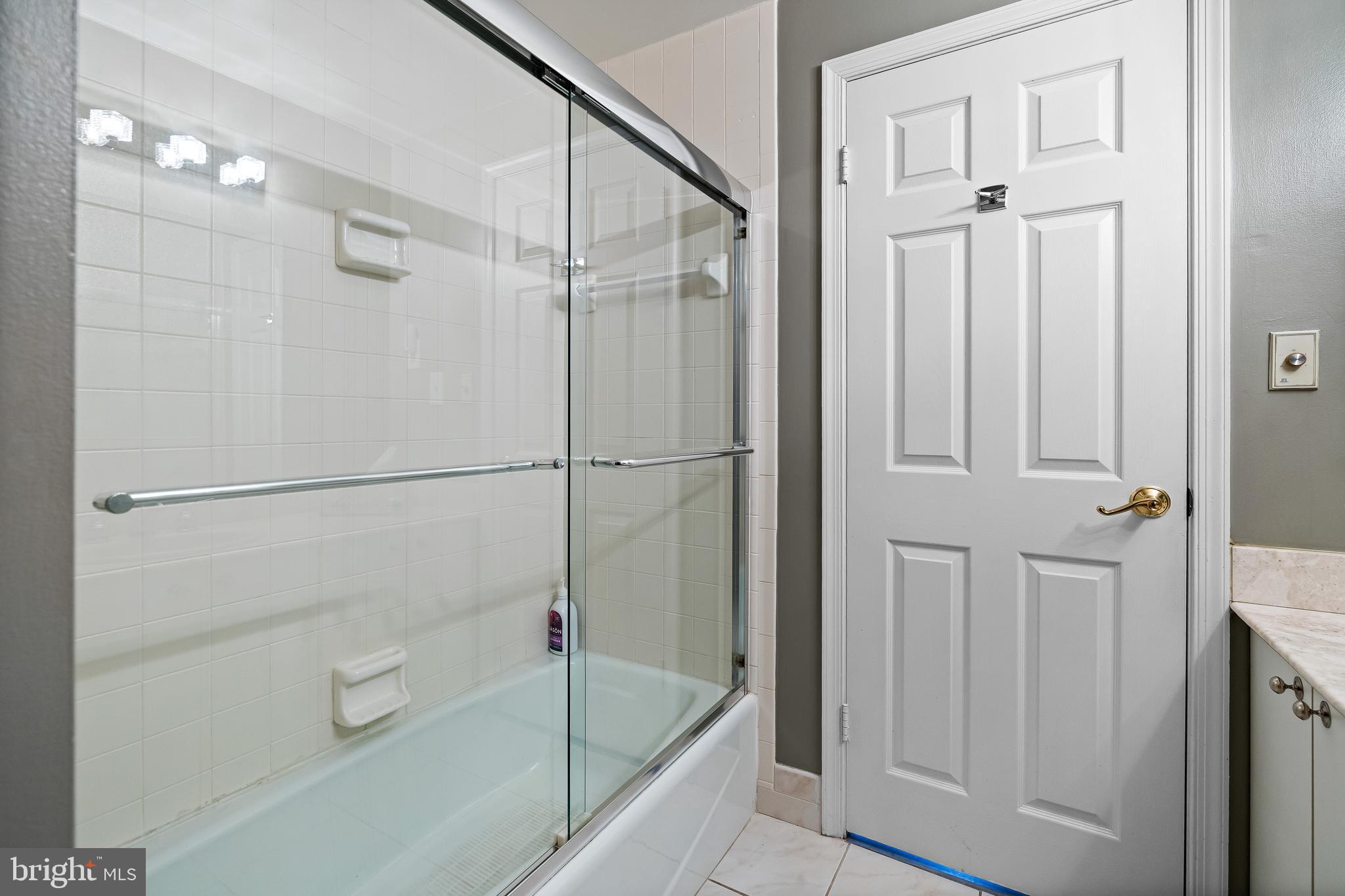 2331 Old Court Road, Unit 307 Baltimore, MD 21208 - Photo 31 of 54 a bathroom with a bathtub and a shower