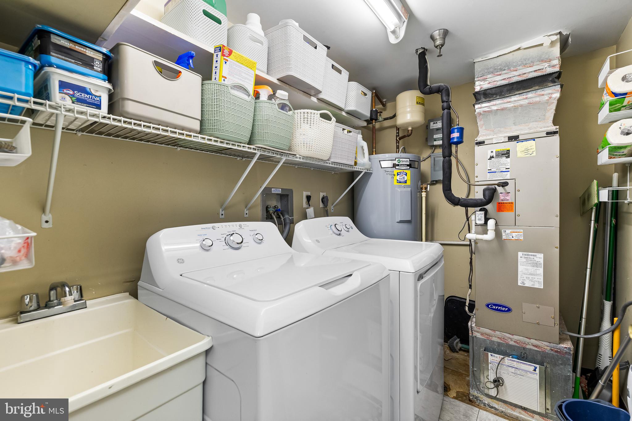 2331 Old Court Road, Unit 307 Baltimore, MD 21208 - Photo 32 of 54 a utility room with dryer and washer