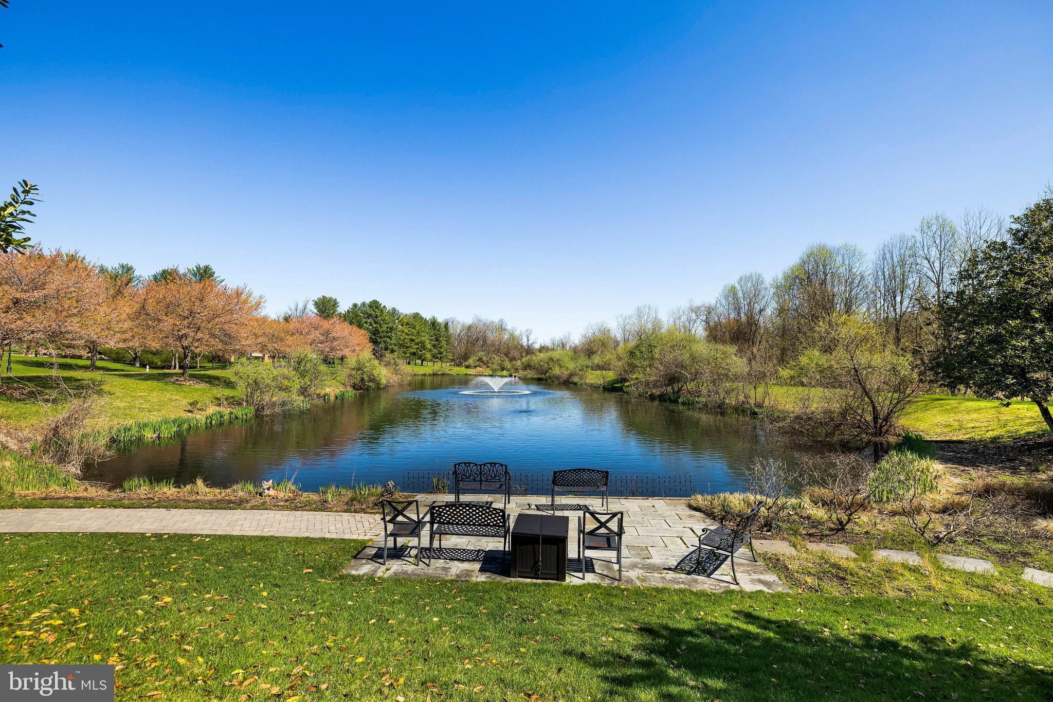 2331 Old Court Road, Unit 307 Baltimore, MD 21208 - Photo 38 of 54 a view of a lake with houses in the back