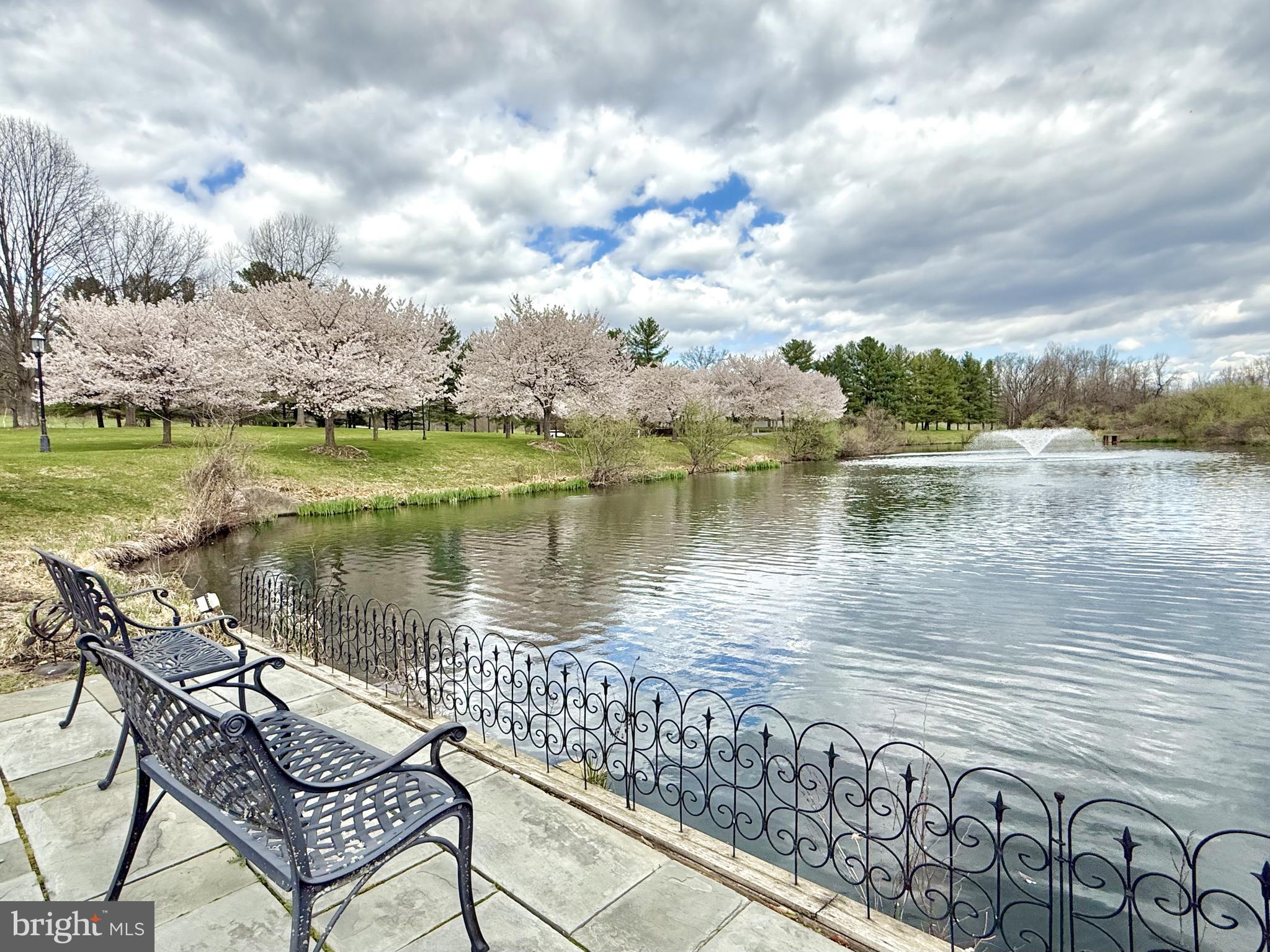 2331 Old Court Road, Unit 307 Baltimore, MD 21208 - Photo 4 of 54 a view of a lake with outdoor seating