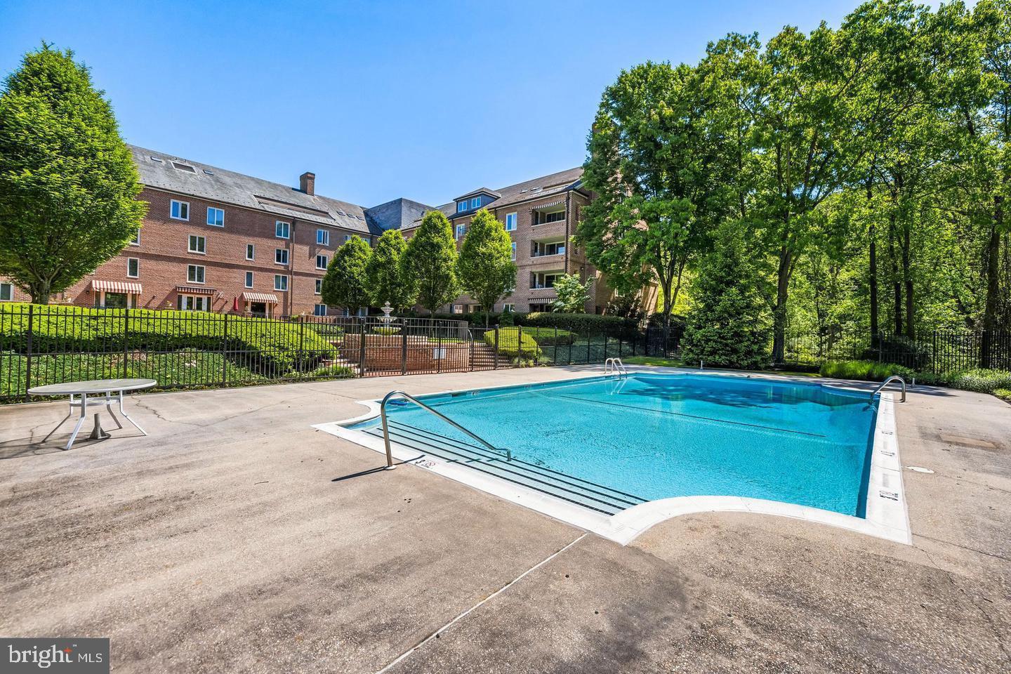 2331 Old Court Road, Unit 307 Baltimore, MD 21208 - Photo 45 of 54 a view of a tennis ground with a large trees