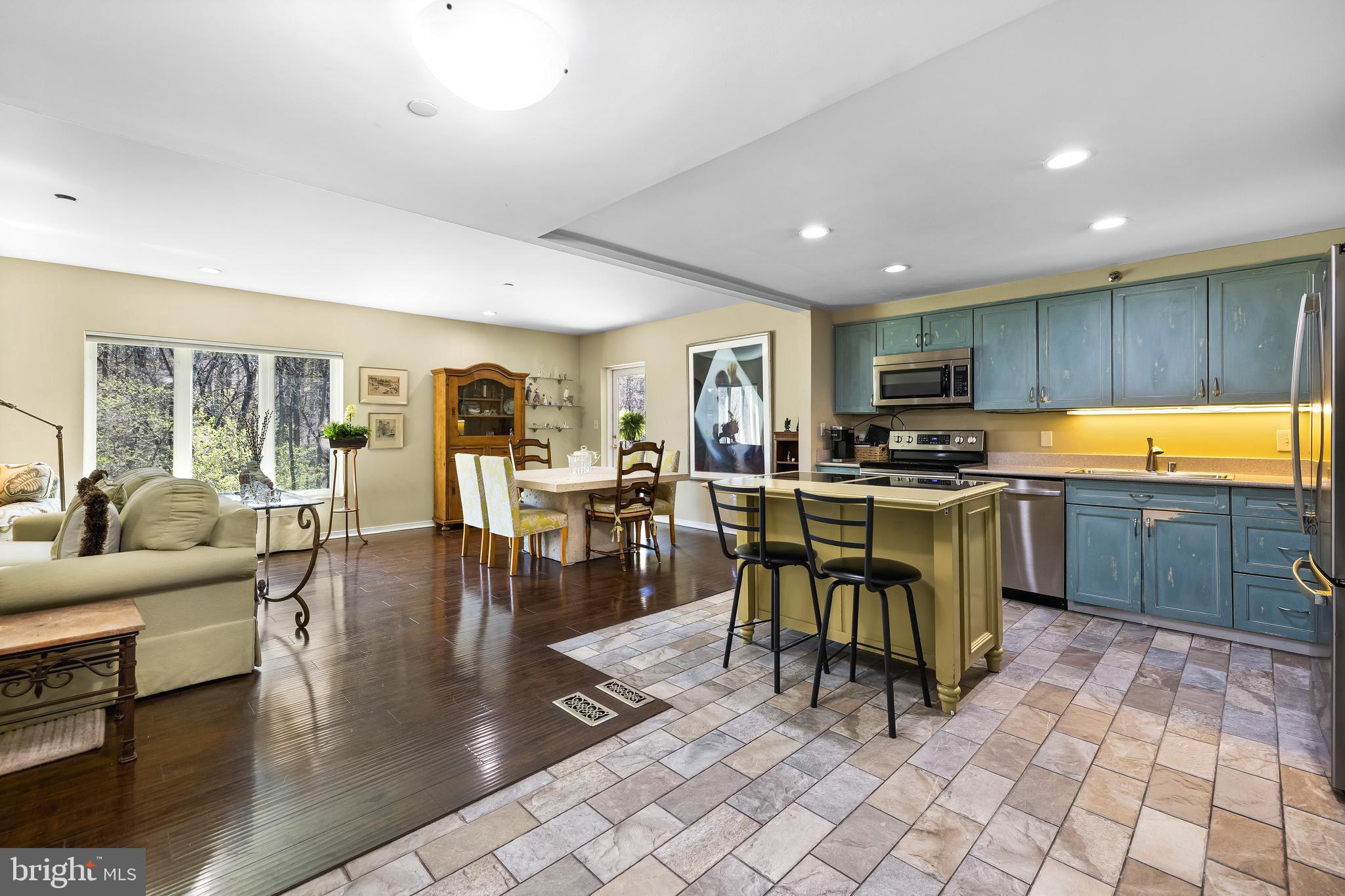 2331 Old Court Road, Unit 307 Baltimore, MD 21208 - Photo 5 of 54 a kitchen with lots of counter top space and stainless steel appliances