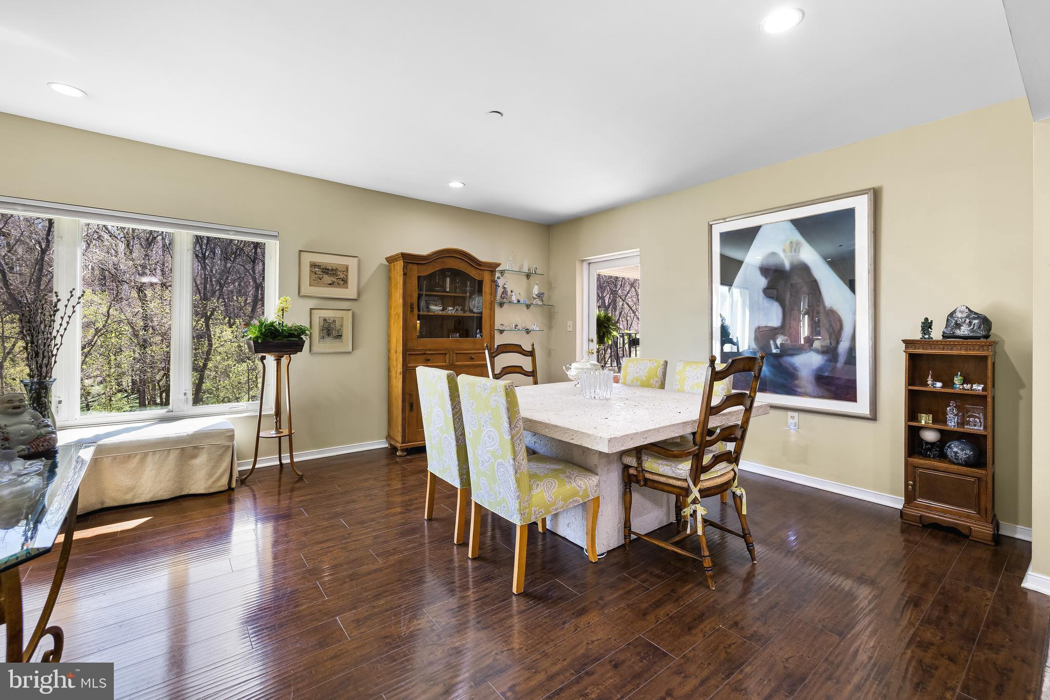 2331 Old Court Road, Unit 307 Baltimore, MD 21208 - Photo 7 of 54 a view of a dining room with furniture and wooden floor