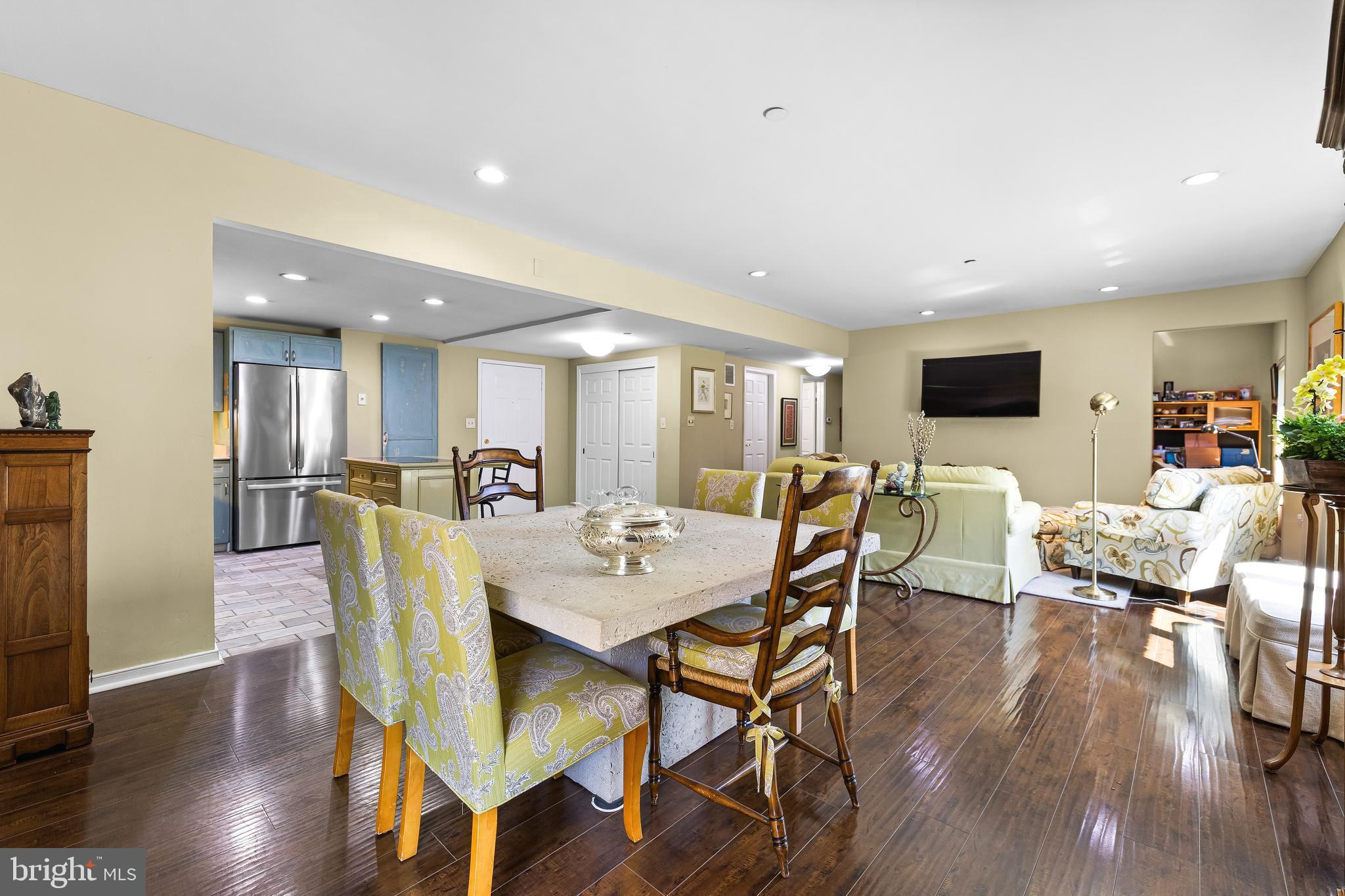 2331 Old Court Road, Unit 307 Baltimore, MD 21208 - Photo 8 of 54 a view of a dining room with furniture and wooden floor