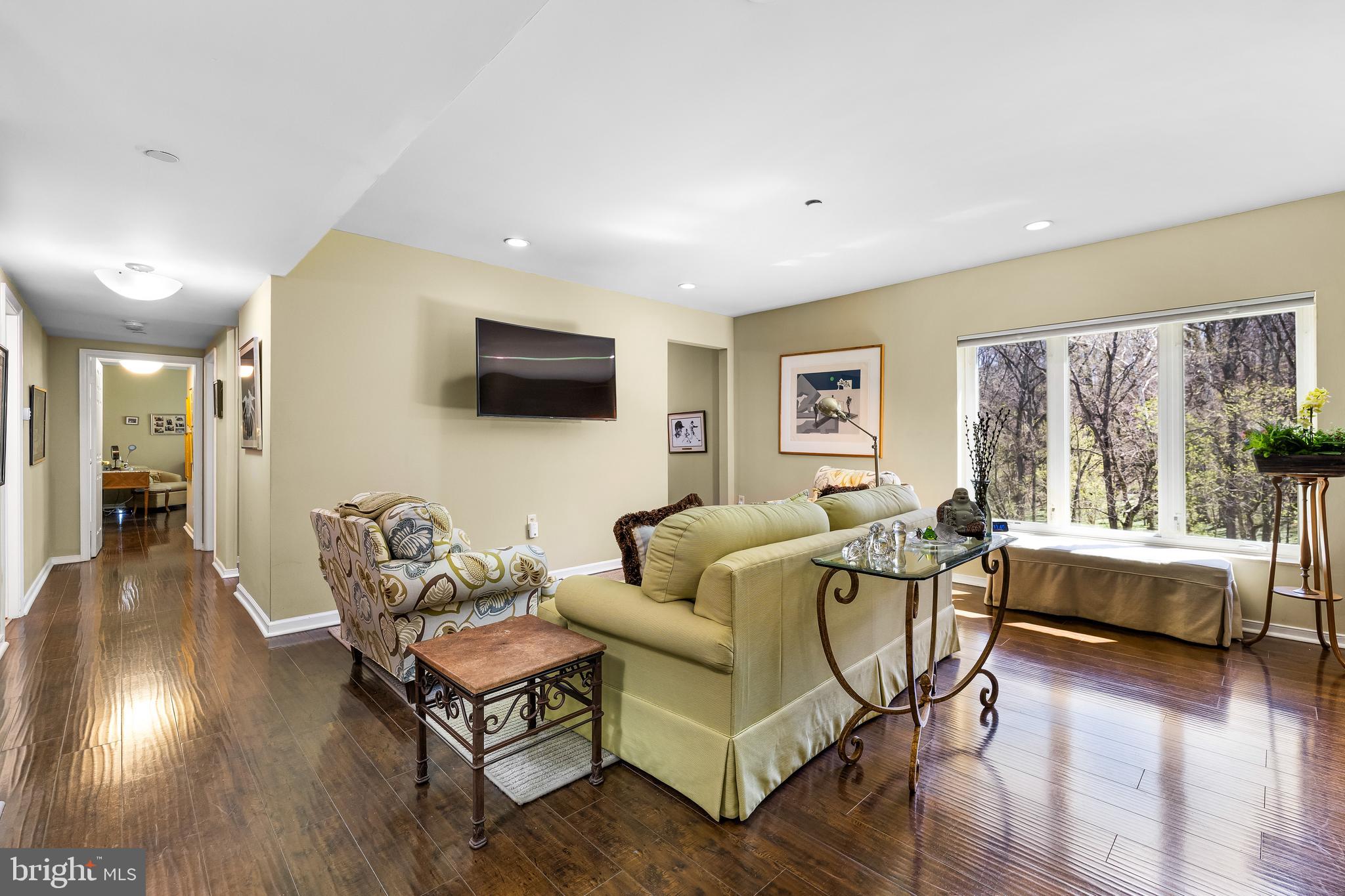 2331 Old Court Road, Unit 307 Baltimore, MD 21208 - Photo 9 of 54 a living room with furniture and a flat screen tv
