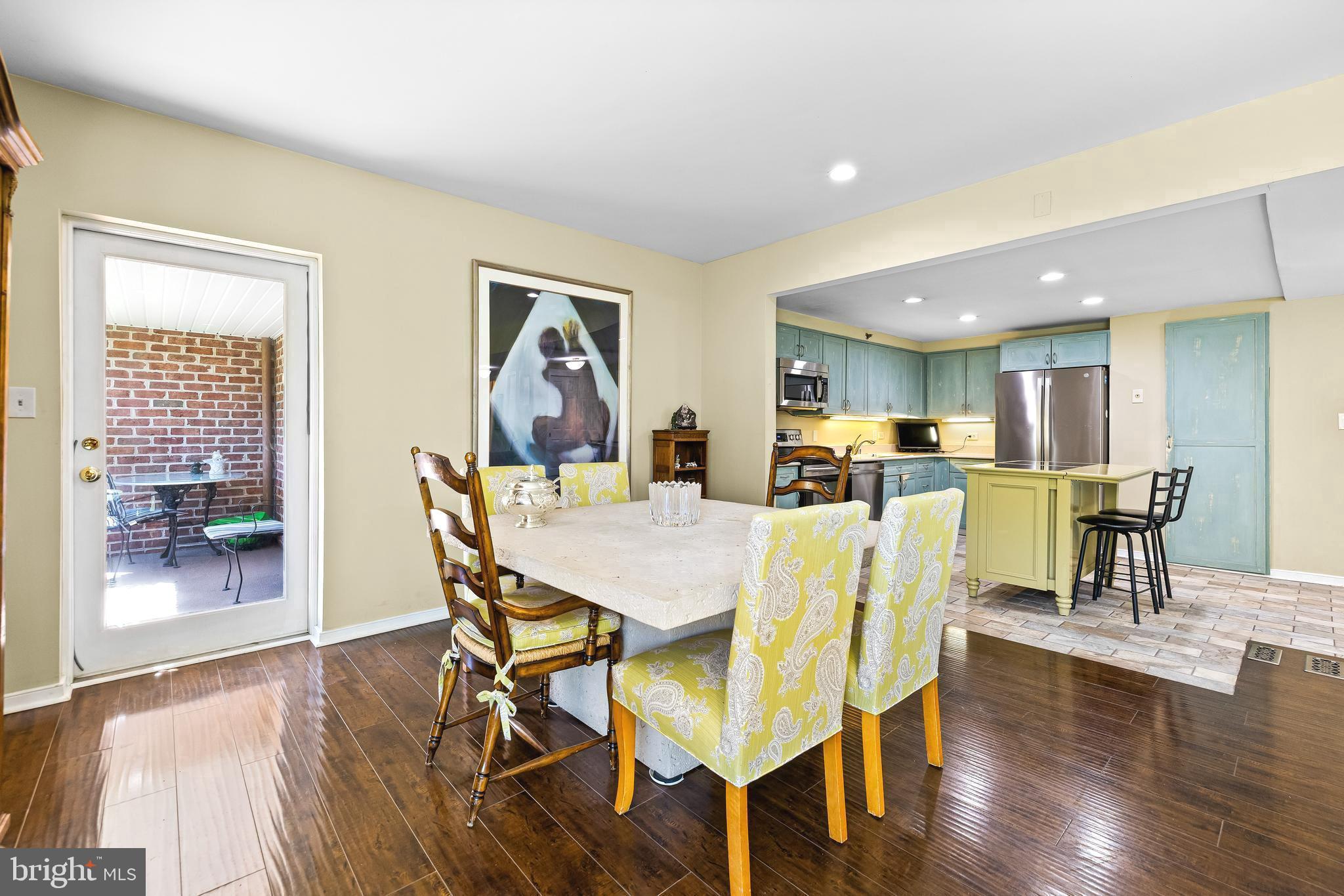 2331 Old Court Road, Unit 307 Baltimore, MD 21208 - Photo 10 of 54 a dining room with furniture and wooden floor