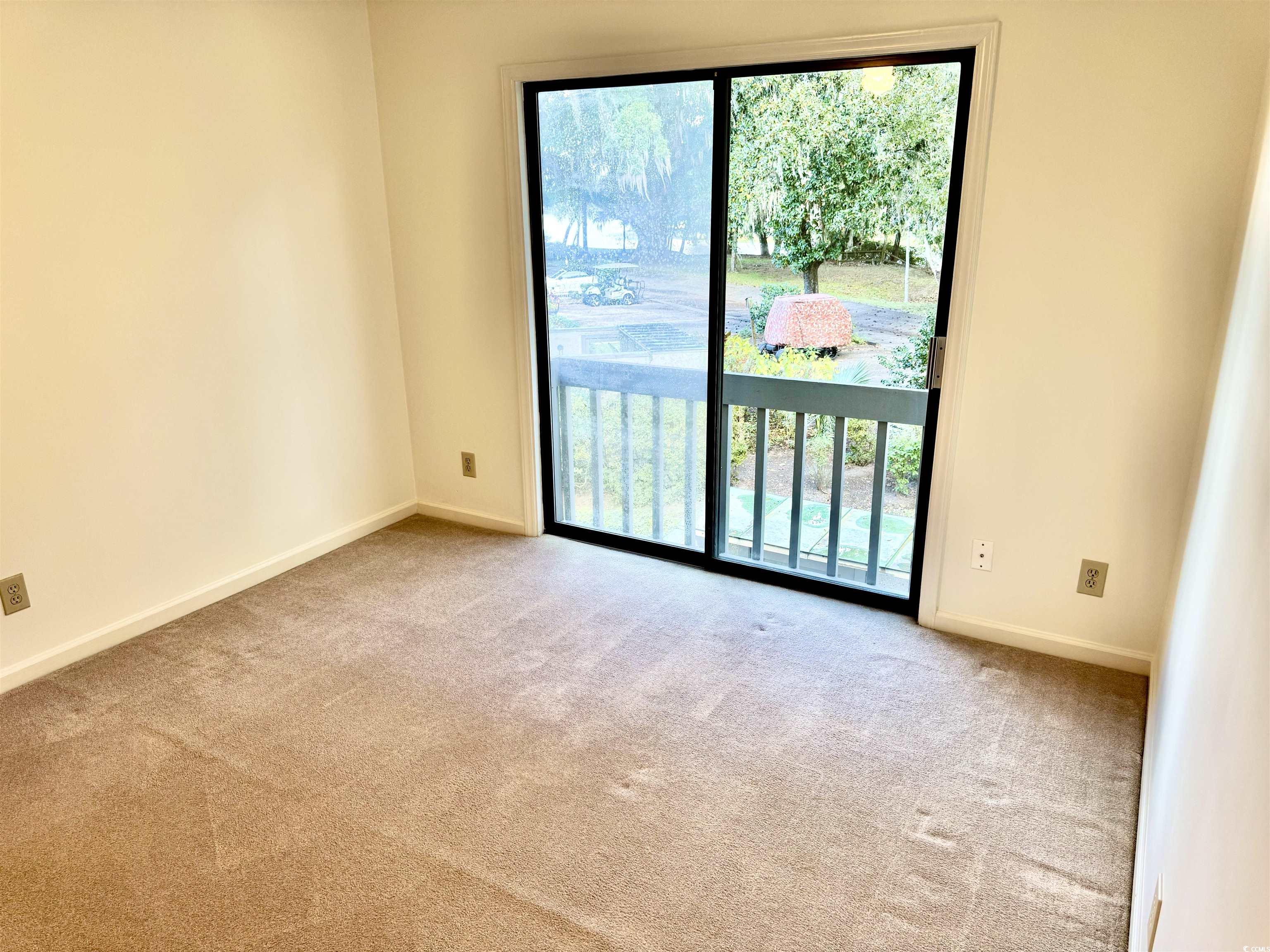 31 Battery White Court, Unit 1005 Georgetown, SC 29440 - Photo 9 of 34 Unfurnished room featuring light colored carpet and baseboards