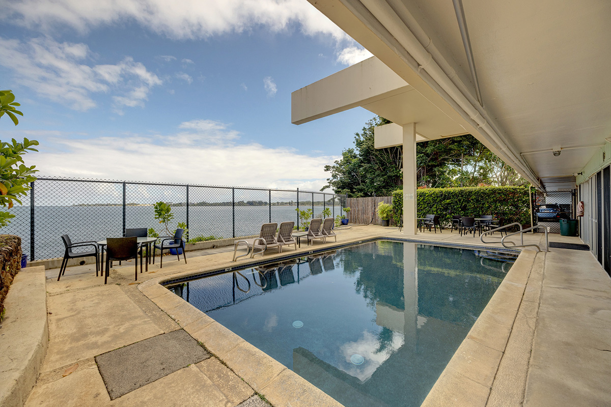 84 Pukihae Street, Unit 406 Hilo, HI 96720 - Photo 18 of 26 a view of a swimming pool with sitting area
