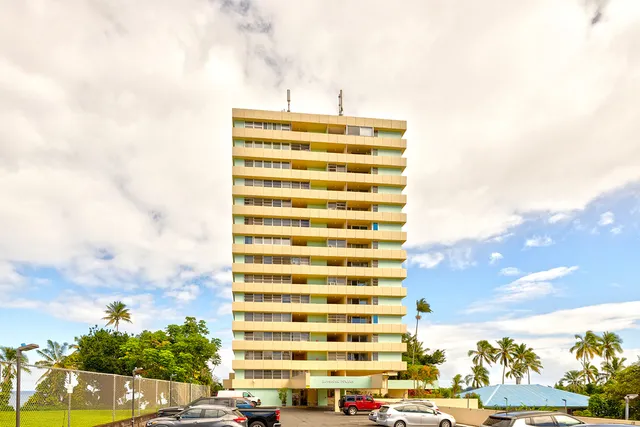 a view of a patio with table and chairs potted plants