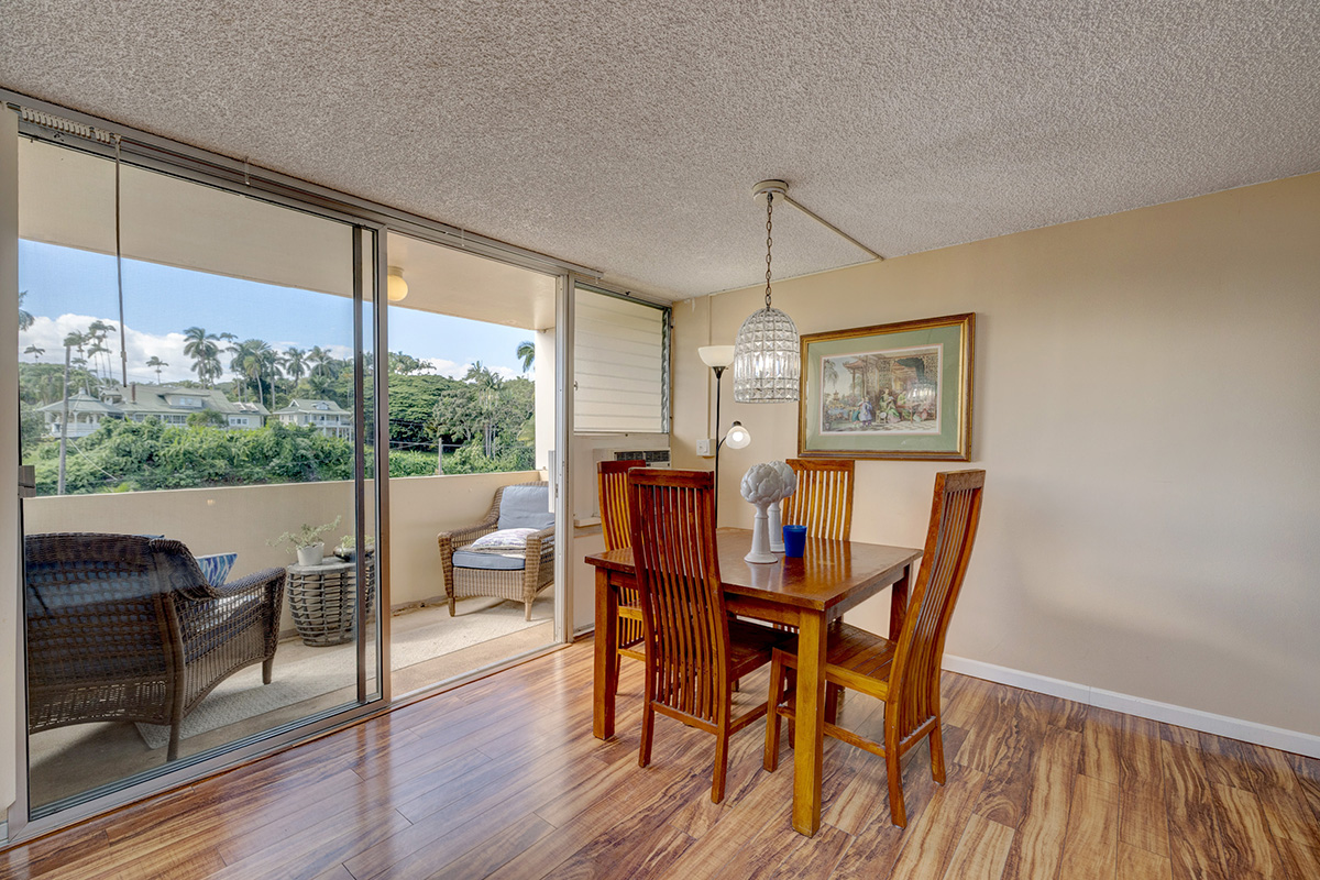 84 Pukihae Street, Unit 406 Hilo, HI 96720 - Photo 10 of 26 a view of a dining room with furniture window and wooden floor