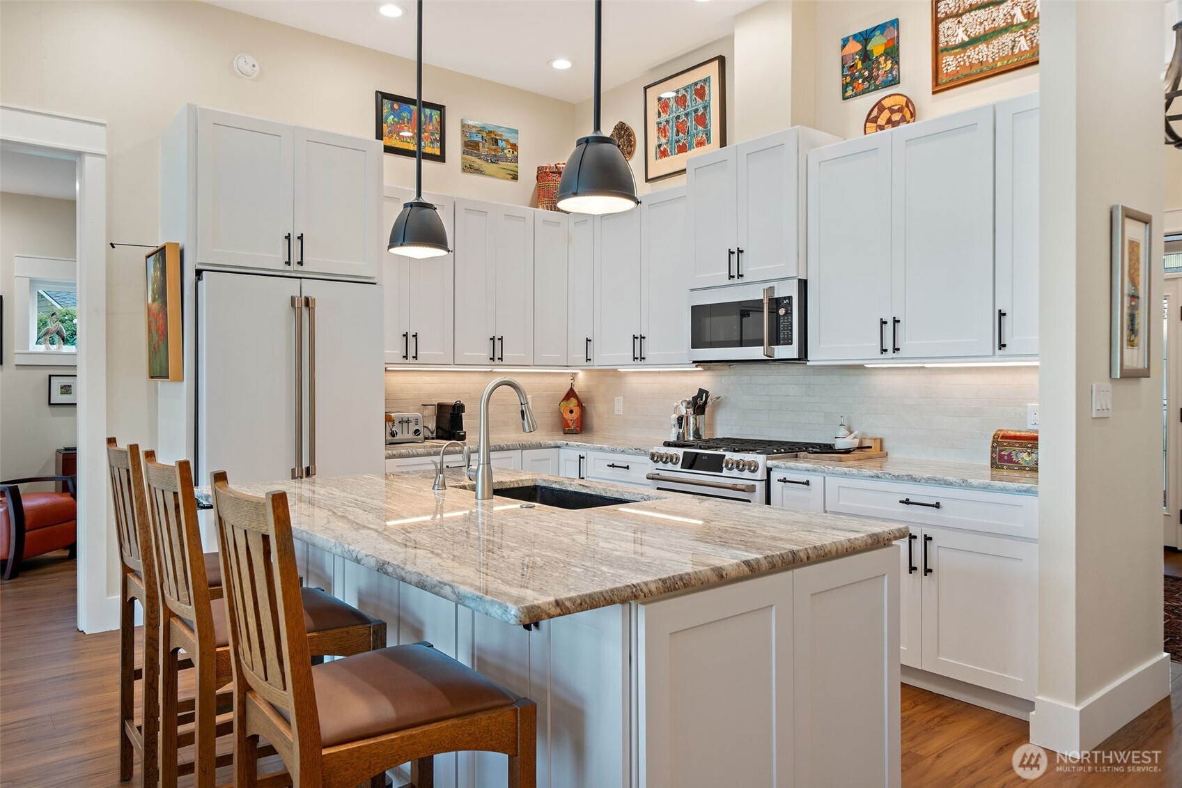 211 East Vineyard Crest Road Grapeview, WA 98546 - Photo 15 of 34 a kitchen with stainless steel appliances granite countertop a stove top oven a refrigerator a sink and a refrigerator