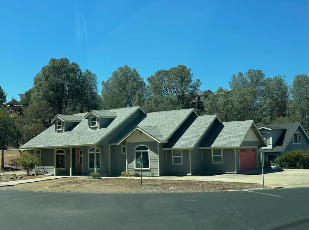 594 Sunrise Road Copperopolis, CA 95228 - Photo 1 of 1 a front view of a house with a garden