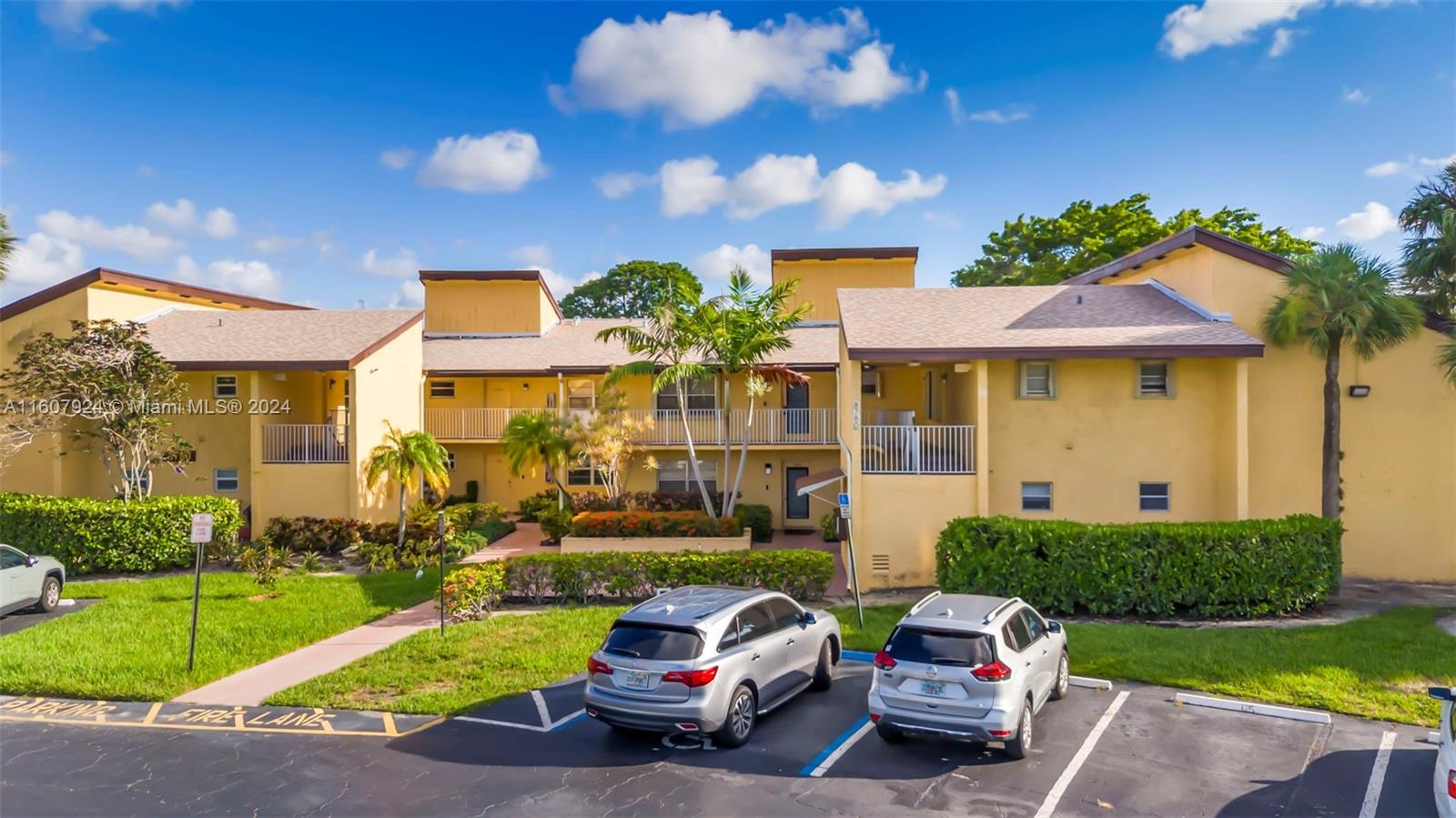 8780 Azalea Court, Unit 104 Tamarac, FL 33321 - Photo 19 of 37 a car parked in front of a house