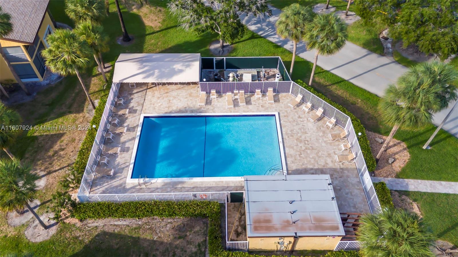 8780 Azalea Court, Unit 104 Tamarac, FL 33321 - Photo 32 of 37 an aerial view of a house with a yard