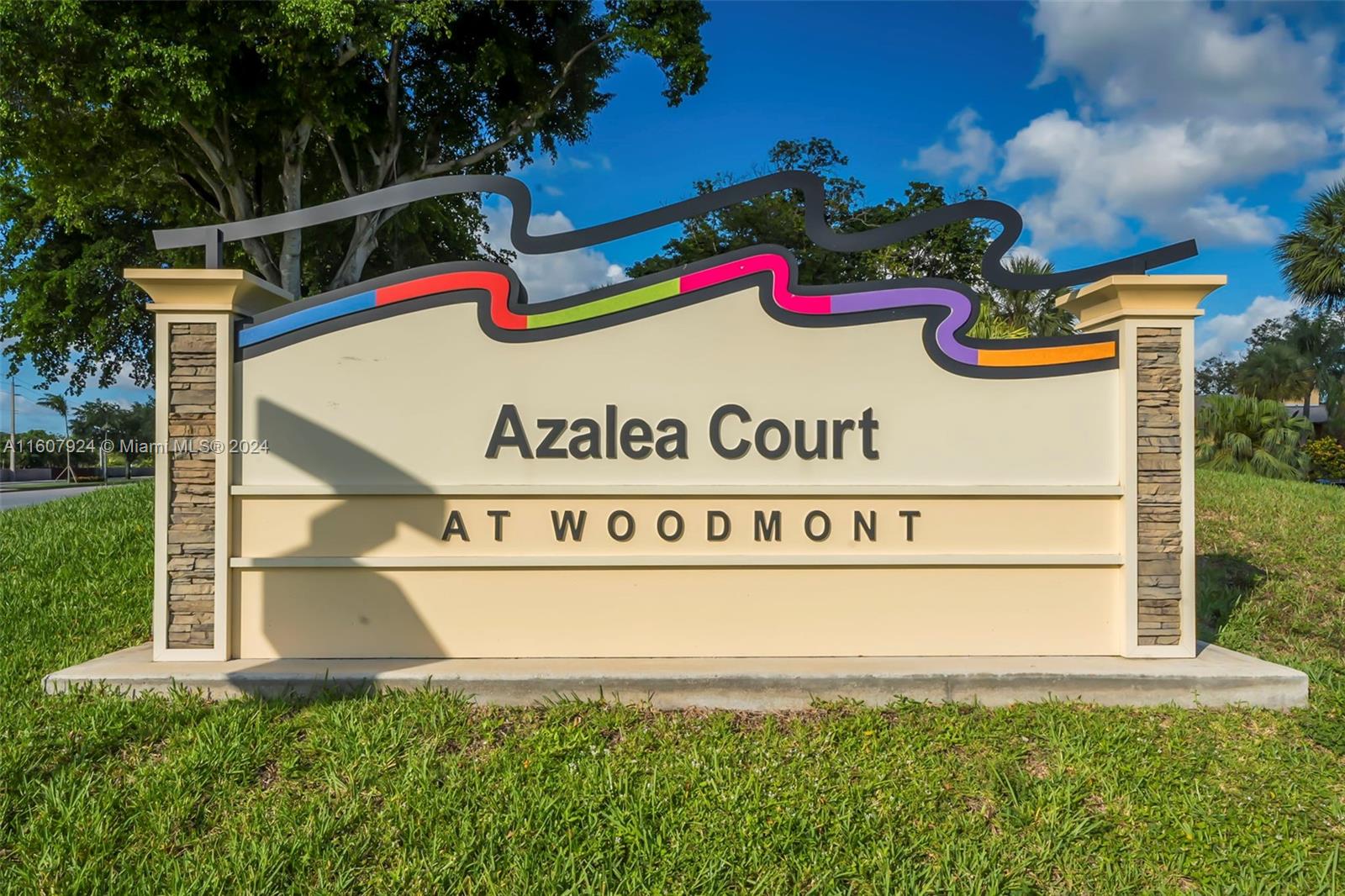 8780 Azalea Court, Unit 104 Tamarac, FL 33321 - Photo 34 of 37 a sign that is on the side of the road